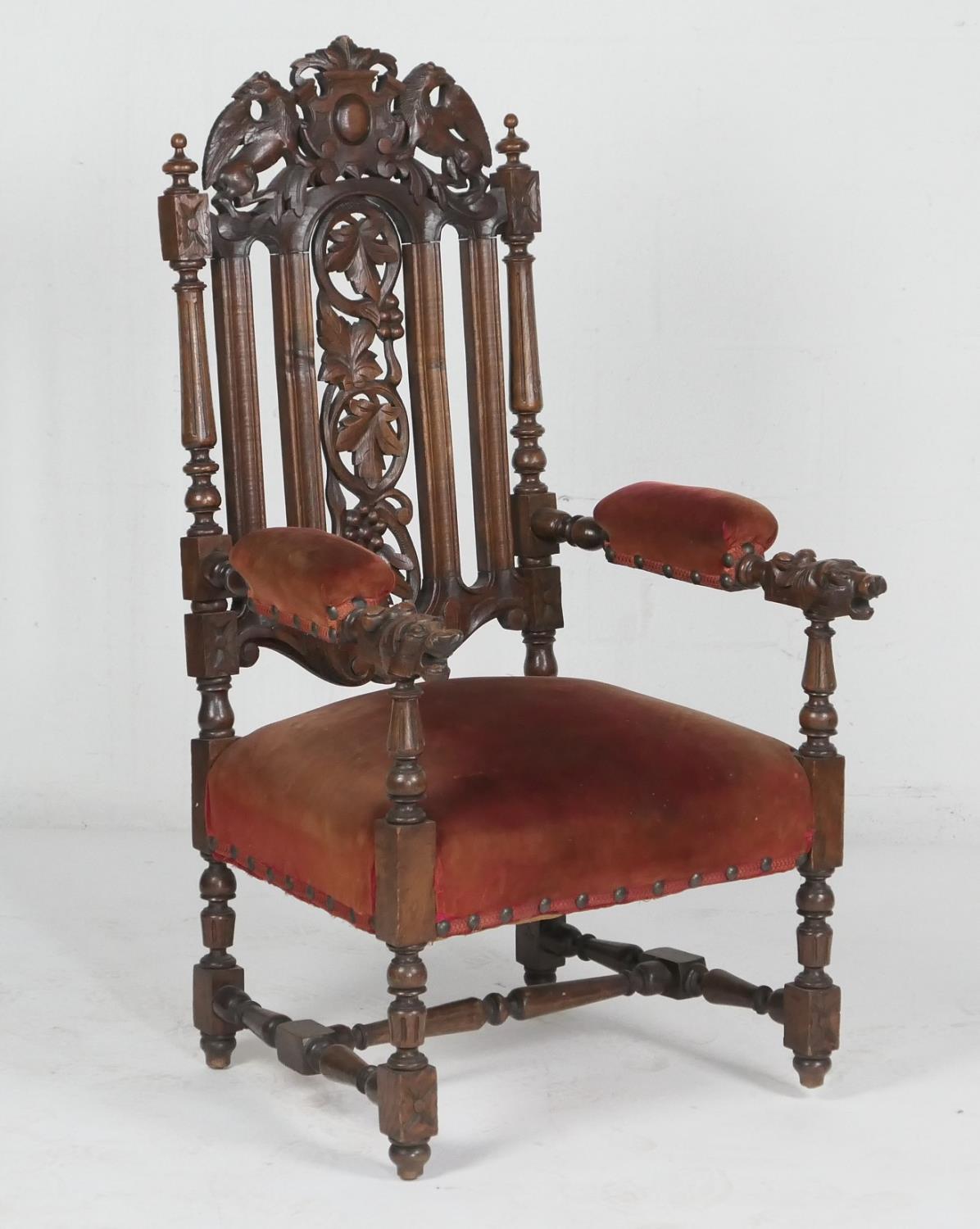 Victorian carved oak and upholstered armchair, circa 1890, the back carved with griffons and centred