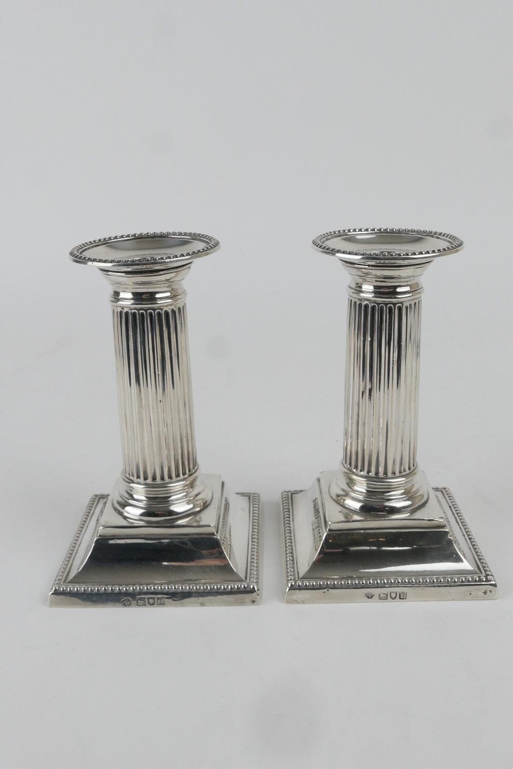 Pair of silver dwarf candlesticks, by William Hutton & Sons, London 1900/01 (loaded), height 13.5cm