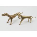 Two Indian brass figures of dogs, stylised form with simplistic decoration, height 9cm