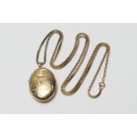 9ct gold oval picture locket, on a 9ct gold boxlink chain necklace, the locket with scrolled foliate