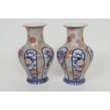 Pair of Japanese Fukugawa porcelain vases, baluster form decorated with panels of dragons, flowers