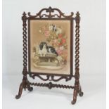 Victorian rosewood and petit-point needlework firescreen, circa 1845, the tapestry featuring Queen