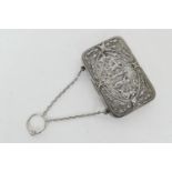 Late Victorian silver purse, Birmingham 1892, rectangular form worked with a figural scene in the