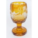 German engraved amber glass goblet, circa 1900, faceted form decorated with a stag and hinds running