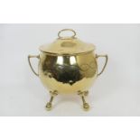 Edwardian brass coal scuttle, cauldron form with a domed lid, raised on claw and ball feet, height