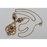 9ct gold and garnet pendant necklace, modern, the openwork pendant centred with a round cut garnet