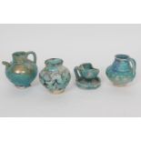 Four examples of ancient Persian faience pottery (12th/13th Century) comprising a small baluster oil