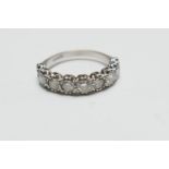 Diamond half eternity ring, in 18ct white gold, set with nine brilliant cut diamonds, illusion set