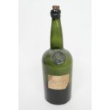 Early 19th Century sealed wine bottle, with a comet seal at the shoulder, paper label inscribed '