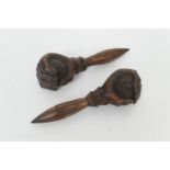 Pair of South German or Swiss carved wooden nutcrackers, formed as a hand holding a walnut, 18cm