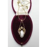 9ct gold mother of pearl pendant necklace, the oval pearl originally with some embellishment