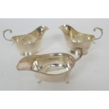 Pair of George V silver sauce boats, by Adie Bros., Birmingham 1929, faceted form, height 10.5cm,
