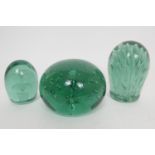 Three Nailsea glass dumps, mid 19th Century, comprising one with an encased two tier flower, 11cm;
