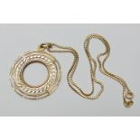 18ct gold concentric ring pendant necklace, the pendant 40mm, the necklace 42cm, gross weight