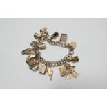 9ct gold charm bracelet, with padlock clasp and safety chain, supporting 15 gold charms, gross