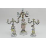 Pair of French porcelain figural candelabra, late 19th Century, modelled as a shepherd and