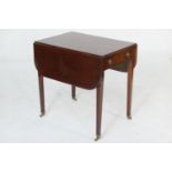 Mahogany Pembroke table, early 19th Century, the top with two fall leaves with reeded edge, over a