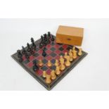 Staunton pattern chess set, in boxwood and ebony, the pieces weighted, with a Morocco leather