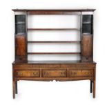 George III oak and mahogany inlaid dresser, circa 1800, having a plate rack with three central