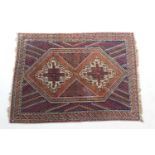 Afshari Dozar woollen rug, the central lozenge form medallion enclosing two fawn, red and blue