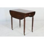 Mahogany Pembroke table in the manner of Gillows, circa 1830, having two drop leaves and a single