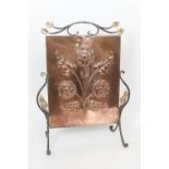 Arts & Crafts copper and wrought iron firescreen, circa 1900, worked with a stylised rose in a
