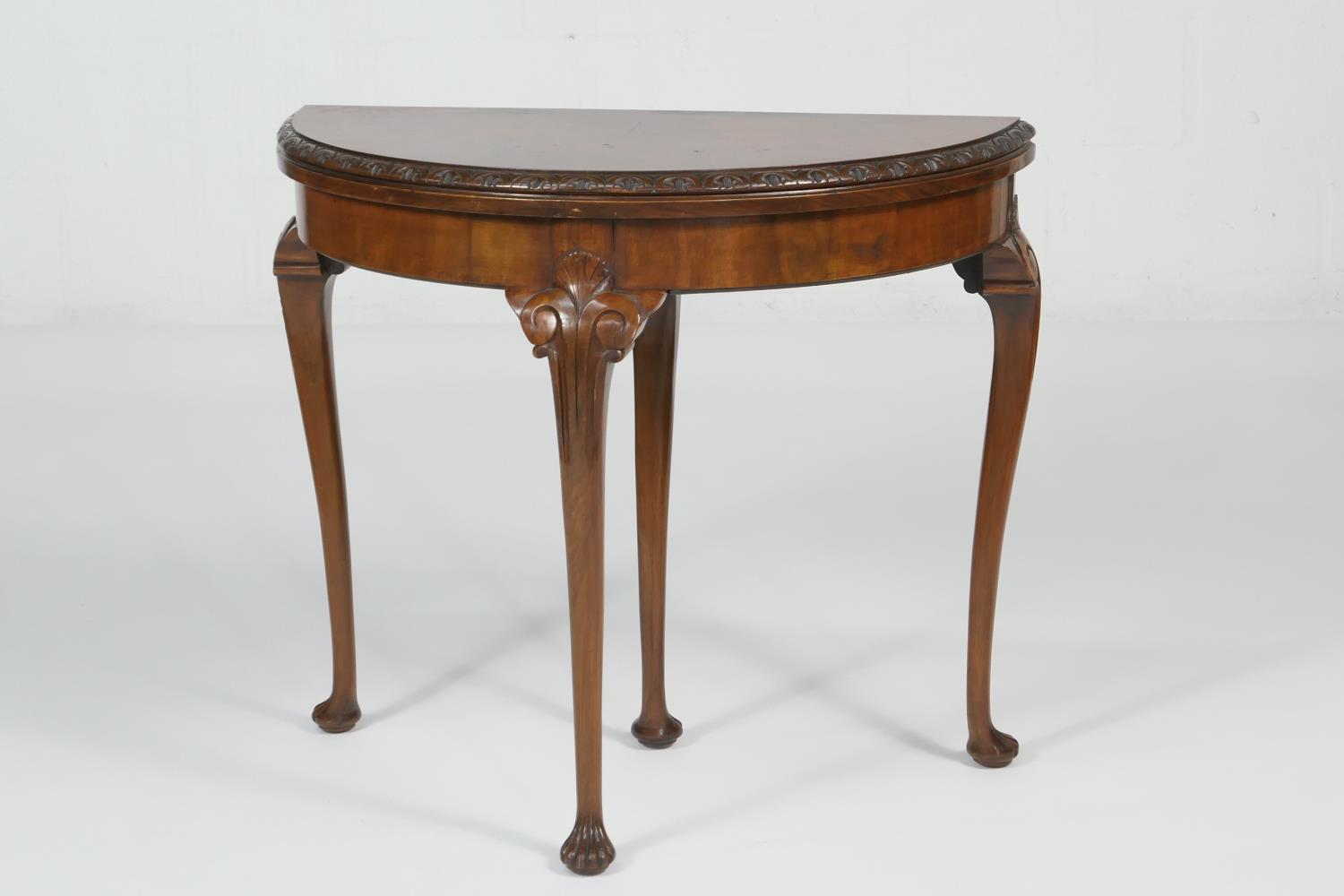 Queen Anne Revival walnut demi-lune card table, circa 1920s, the folding top opening to reveal a