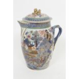 Chinese clobbered blue and white export jug and cover, barrel shape decorated with a pavilion and