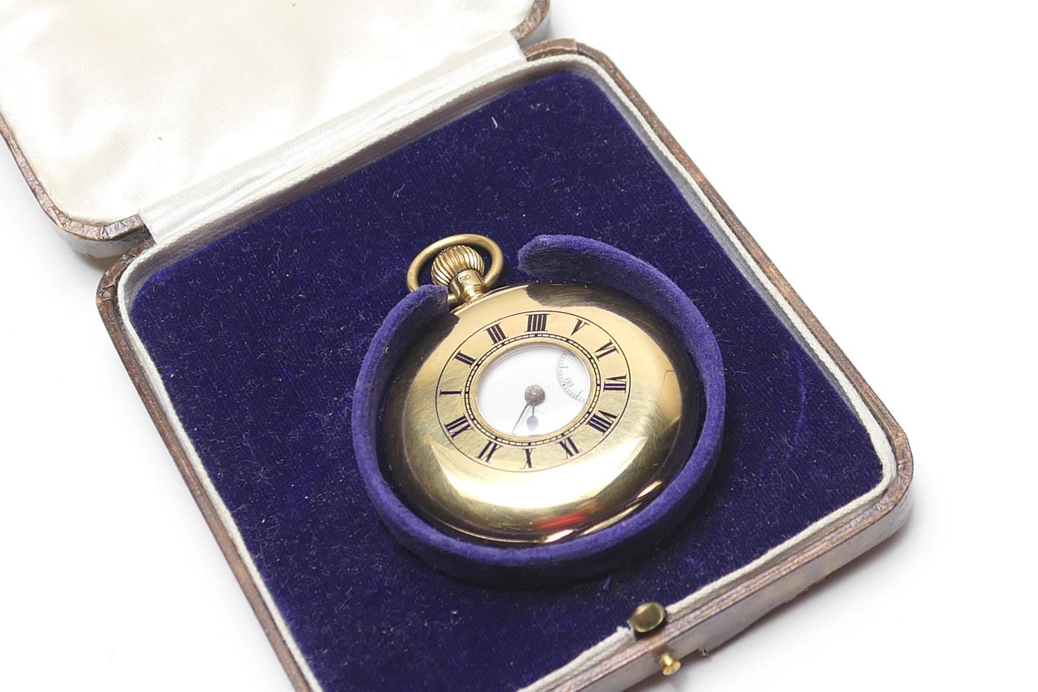 George V 18ct gold half hunter pocket watch, London 1928, outer case with blue enamelled Roman