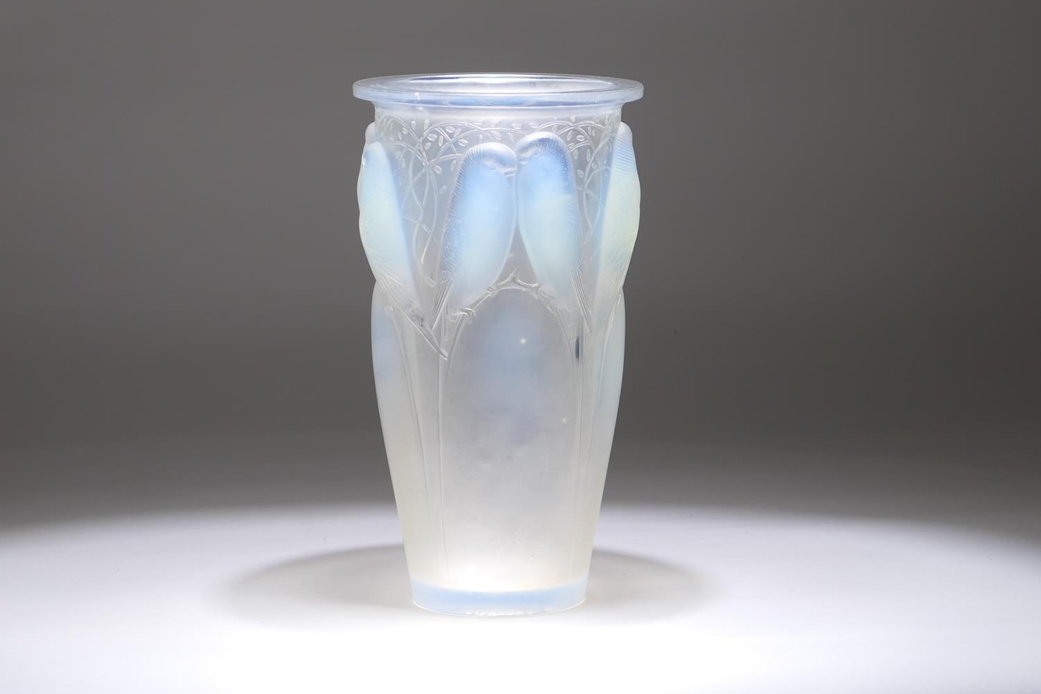 Lalique Ceylan vase, number 905, moulded with pairs of budgerigars, frosted and tinted with blue