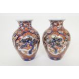 Pair of Japanese imari vases, late Meiji (1868-1912), ovoid form decorated with pine tree reserves