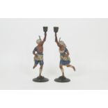 Pair of French cold painted spelter figural candlesticks, late 19th Century, each cast with a