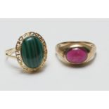 14ct gold malachite dress ring, the cabochon stone within a keyed border on a split shank ring, size