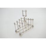 Attributed to Dr. Christopher Dresser, an Elkington electroplated toast rack, six divisions and a