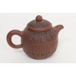 Chinese Yixing teapot, globular form incised with a band of script, within carved leaf borders,