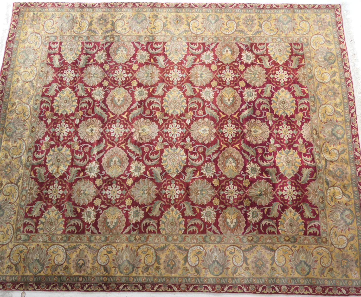Frith style woollen Agra carpet, red field with large palmettes within a gold palmette border,