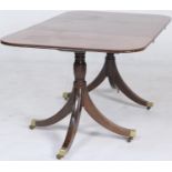 Regency mahogany twin pedestal dining table of small proportions, having D-ends accommodating one