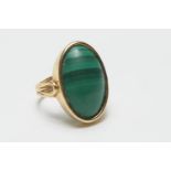 18ct gold malachite dress ring, the cabochon stone approx. 19mm x 12mm, in a collet mount, on a