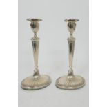 Pair of Edwardian silver candlesticks by Elkington & Co., Birmingham 1907, in Adam style having an