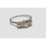 Diamond three stone ring, the central old round cut diamond of approx. 0.7ct flanked by two small
