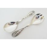Pair of Georg Jensen hammered silver salad serving spoons, pattern no. 42 'Peapod', maker's mark '
