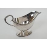 Modern silver footed sauce boat, Sheffield 1979, with gadrooned edge and footrim, height 12.5cm,