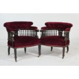 Pair of Victorian mahogany and red velvet upholstered tub chairs, circa 1890, deep buttoned U-shaped