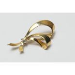 18ct gold and diamond bow brooch, the yellow gold double bow centred with a white gold ribbon, inset