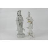 Chinese blanc de chine porcelain figure of Guanyin, serenely modelled standing on a base of waves,