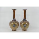 Pair of Royal Doulton stoneware bottle vases, Persian inspired shape decorated with bold stylised