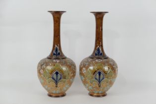 Pair of Royal Doulton stoneware bottle vases, Persian inspired shape decorated with bold stylised