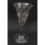 Large ale glass, the trumpet bowl engraved with hops and barley over a solid stem with a single