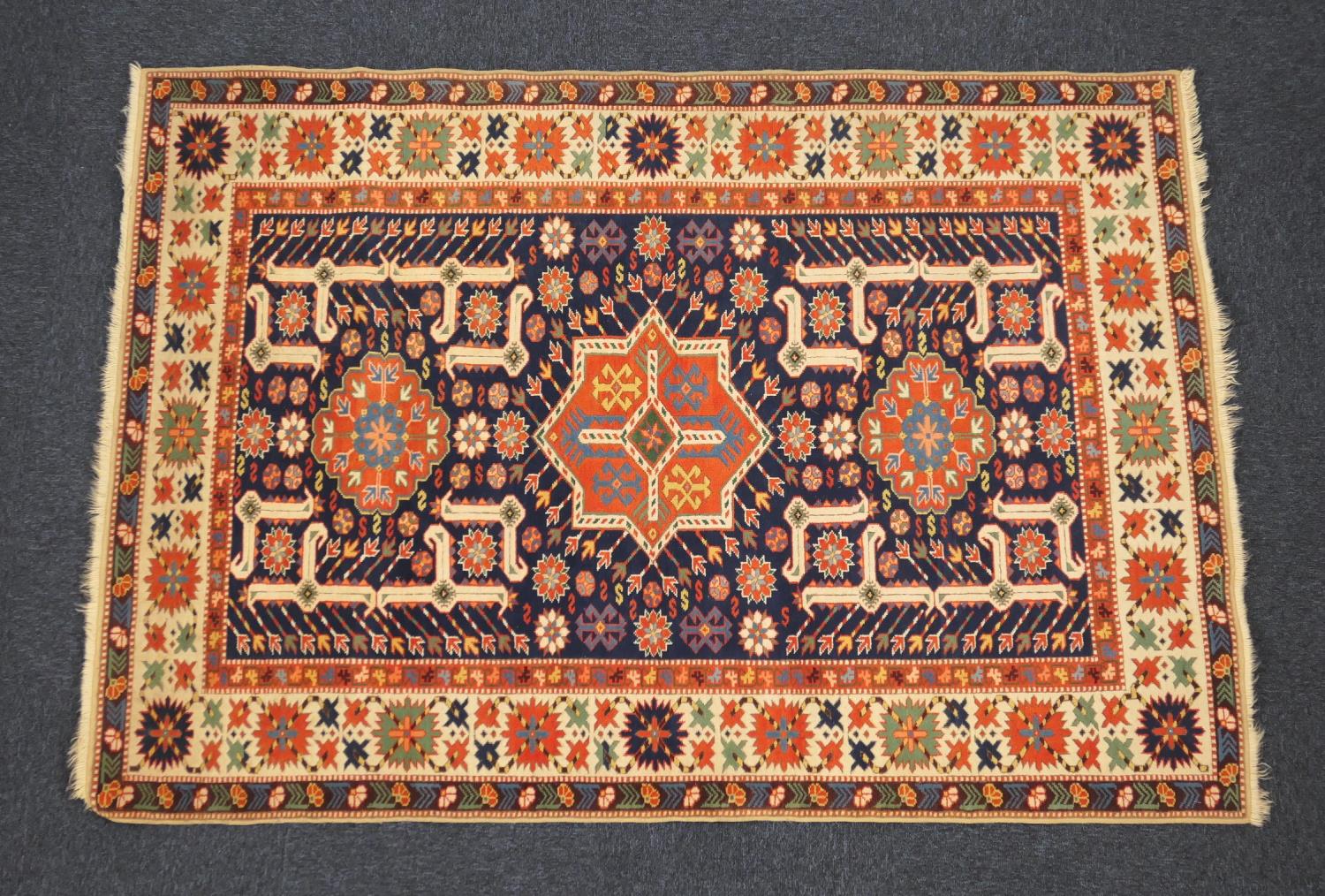 Hamadan woollen rug, having a deep blue ground centred with a star medallion and two lozenge