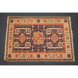 Hamadan woollen rug, having a deep blue ground centred with a star medallion and two lozenge